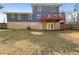 Large backyard featuring a deck, providing outdoor entertainment space and room for activities at 7330 White Flag Trl, Lithia Springs, GA 30122