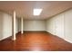 Finished basement with new flooring, lighting, and neutral paint at 7330 White Flag Trl, Lithia Springs, GA 30122