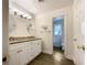 Bright bathroom with double vanity, granite countertops, modern fixtures, and a separate toilet room at 7330 White Flag Trl, Lithia Springs, GA 30122