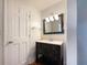 Updated vanity in bathroom with modern lighting and fixtures at 7330 White Flag Trl, Lithia Springs, GA 30122
