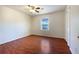 Bedroom with ceiling fan, wood floors, closet and window with view at 7330 White Flag Trl, Lithia Springs, GA 30122