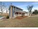Charming two-story home with a brick chimney and inviting front porch at 7330 White Flag Trl, Lithia Springs, GA 30122