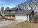 Attractive home with a blend of stone and siding, an attached garage, and a well-kept driveway at 7330 White Flag Trl, Lithia Springs, GA 30122