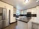 Modern kitchen with stainless steel appliances and granite countertops at 7330 White Flag Trl, Lithia Springs, GA 30122