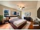 Relaxing main bedroom with a comfortable bed, ambient lighting, and stylish decor at 7330 White Flag Trl, Lithia Springs, GA 30122