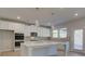 Spacious kitchen showcasing ample white cabinetry, sleek stainless steel appliances, and a large island at 112 Felicity Pike, Locust Grove, GA 30248