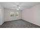 Cozy bedroom with plush carpeting, neutral walls, and a ceiling fan, creating a comfortable retreat at 131 Ellis Dr, Conyers, GA 30012