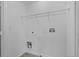Laundry room with hookups, white walls, white trim, and gray flooring at 131 Ellis Dr, Conyers, GA 30012