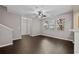 Bright living room features hardwood floors, neutral paint, and large windows that offer ample natural light at 131 Ellis Dr, Conyers, GA 30012