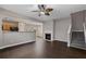 Inviting living room boasts wood floors, a fireplace, and an open layout to the kitchen and dining area at 131 Ellis Dr, Conyers, GA 30012