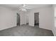 Spacious main bedroom with plush carpeting, neutral walls, ensuite bathroom and closet access at 131 Ellis Dr, Conyers, GA 30012