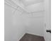 Walk-in closet with carpet and white wire shelving for organized storage at 131 Ellis Dr, Conyers, GA 30012