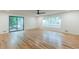 Living room featuring hardwood floors, a large window, and access to the outdoors at 418 Mockingbird, Smyrna, GA 30082