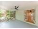 Bright screened porch has a ceiling fan and opens to interior room through french doors at 418 Mockingbird, Smyrna, GA 30082