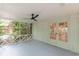 Bright screened porch has a ceiling fan and opens to interior room through french doors at 418 Mockingbird, Smyrna, GA 30082
