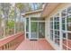 Exterior view of back porch with painted wood and view of trees in yard at 868 Clarion Way, Lawrenceville, GA 30044