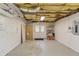 Unfinished basement featuring exposed ceiling, utility closet, and storage shelving at 868 Clarion Way, Lawrenceville, GA 30044