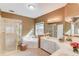 Bright bathroom features a tiled shower, soaking tub, and white cabinets at 868 Clarion Way, Lawrenceville, GA 30044