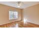 Bedroom with hardwood floors, neutral paint, and natural light at 868 Clarion Way, Lawrenceville, GA 30044