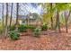 Back exterior view of home with screened-in porch, deck, and wooded surroundings at 868 Clarion Way, Lawrenceville, GA 30044