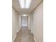 Hallway features laminate wood floors and neutral paint at 868 Clarion Way, Lawrenceville, GA 30044