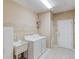 Well-lit laundry room with ample storage and modern appliances at 868 Clarion Way, Lawrenceville, GA 30044