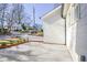 Side view of a home exterior and sidewalk on a sunny day at 3165 Old Jonesboro Rd, Hapeville, GA 30354