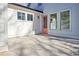 View of a home's backyard patio with a peach-colored door at 3165 Old Jonesboro Rd, Hapeville, GA 30354