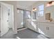 Spacious bathroom featuring double vanities, sleek mirrors, and a modern walk-in shower at 3165 Old Jonesboro Rd, Hapeville, GA 30354