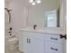 Modern bathroom featuring a large mirror, vanity with white cabinets and marble top at 3165 Old Jonesboro Rd, Hapeville, GA 30354