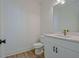 Bathroom featuring a white vanity with stone countertops, stainless steel hardware and tile flooring at 3165 Old Jonesboro Rd, Hapeville, GA 30354