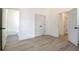 Bright bedroom with wood floor, closet, and bathroom view creates a tranquil and functional living space at 3165 Old Jonesboro Rd, Hapeville, GA 30354