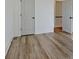 Light-filled bedroom features hardwood floors, white trim, and open doorway at 3165 Old Jonesboro Rd, Hapeville, GA 30354