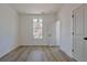 Bedroom with wood floors, white trim, and a window at 3165 Old Jonesboro Rd, Hapeville, GA 30354