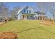 Charming two-story home featuring a welcoming front porch and a well-maintained front yard at 3165 Old Jonesboro Rd, Hapeville, GA 30354