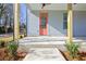 Charming front porch featuring ceiling fans and a stylish entry door at 3165 Old Jonesboro Rd, Hapeville, GA 30354