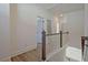 Upper hallway with wood floors features a white railing and trim for classic aesthetic appeal at 3165 Old Jonesboro Rd, Hapeville, GA 30354