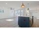 Open-concept kitchen boasts an island with pendant lights at 3165 Old Jonesboro Rd, Hapeville, GA 30354