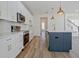 Bright kitchen with white cabinetry, an island, and stainless-steel appliances at 3165 Old Jonesboro Rd, Hapeville, GA 30354