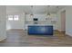 Modern kitchen with an island, pendant lights and white cabinetry at 3165 Old Jonesboro Rd, Hapeville, GA 30354