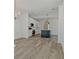 Open kitchen with a large island, stainless appliances, white cabinets and a tile backsplash at 3165 Old Jonesboro Rd, Hapeville, GA 30354