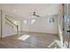 Sun-filled living room with ceiling fan, hardwood floors and several windows at 3165 Old Jonesboro Rd, Hapeville, GA 30354
