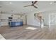 Bright open-concept living room with a staircase and kitchen at 3165 Old Jonesboro Rd, Hapeville, GA 30354