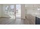 Open living room with hardwood floors, modern lighting and backyard view at 3165 Old Jonesboro Rd, Hapeville, GA 30354