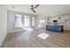 Spacious living room flows into kitchen area, features hardwood floors and natural light at 3165 Old Jonesboro Rd, Hapeville, GA 30354