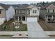 Charming two-story home featuring a landscaped front yard and a covered porch at 7266 Gladstone Cir, Lithonia, GA 30038
