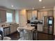 Modern kitchen featuring a center island, stainless steel appliances, and granite countertops at 7266 Gladstone Cir, Lithonia, GA 30038