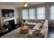 Comfortable living room with fireplace and natural light at 7266 Gladstone Cir, Lithonia, GA 30038