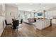 Open floor plan with a kitchen island, dining area, and living room, perfect for entertaining at 783 Cygnet Ln, Grayson, GA 30017