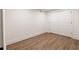 Bedroom in basement features wood flooring, closet, and recessed lighting at 5548 Martina Way, Atlanta, GA 30338